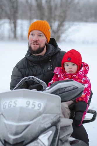 linus and livia on the snowmobile 